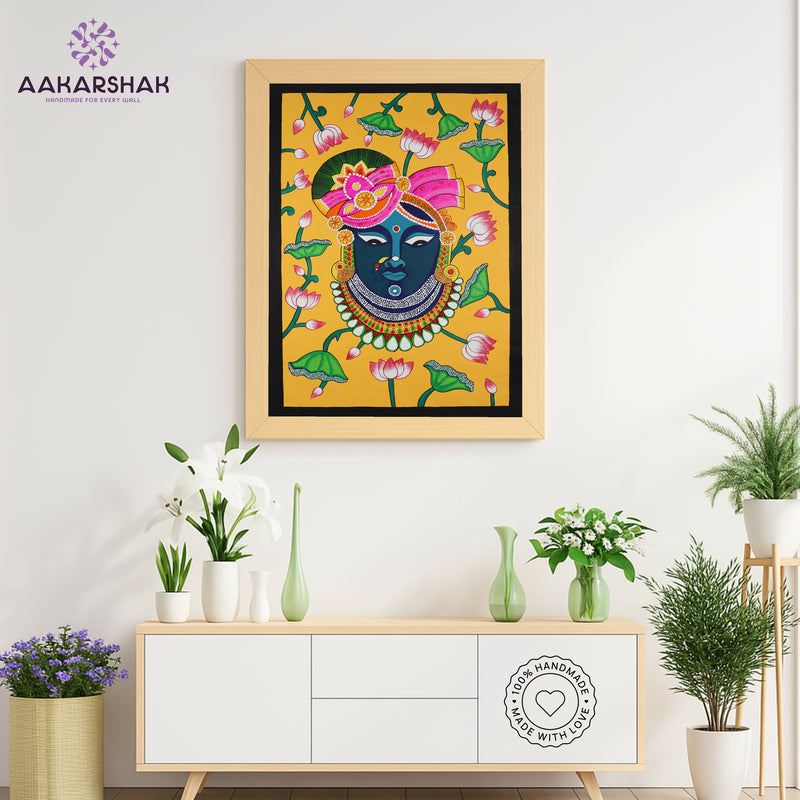 Close-up of hand-painted Pichwai design using vibrant colors and natural themes