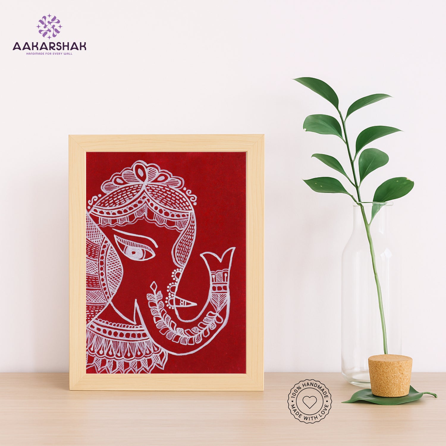 Hand-painted Madhubani artwork placed on shelf with tabletop stand
