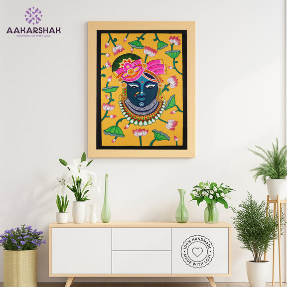 Close-up of hand-painted Pichwai design using vibrant colors and natural themes
